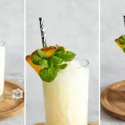 Orzeźwiający drink w kokosie, udekorowany ananasem i miętą, idealny na upalne dni.